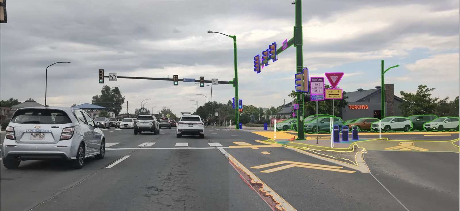 A street scene with detections outlined by the model